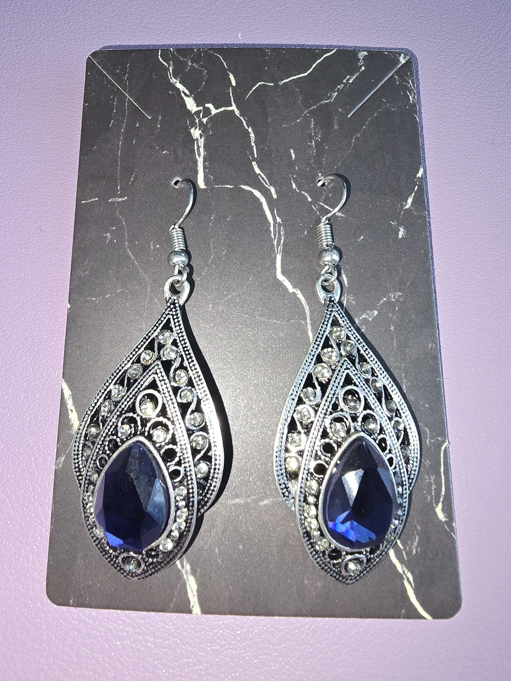 Elegant Silver-Tone Teardrop Earrings with Deep Blue Gem